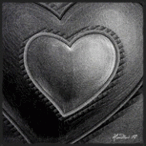 A Black And White Photo Of A Heart In The Middle Of Two Hearts . GIF