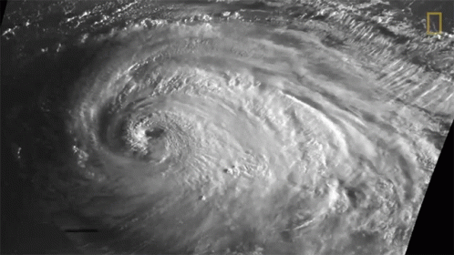 A Black And White Photo Of A Hurricane With The National Geographic Logo On The Bottom Right GIF