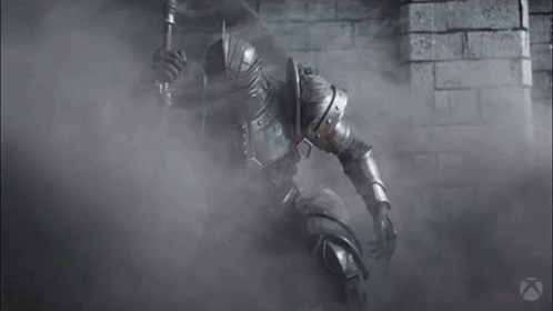 A Black And White Photo Of A Knight In Armor Holding A Sword GIF