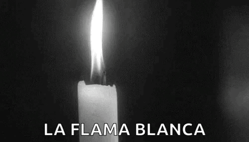 A Black And White Photo Of A Lit Candle With The Words La Flama Blanca Written On The Bottom GIF