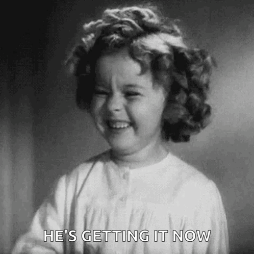 A Black And White Photo Of A Little Girl Laughing . GIF