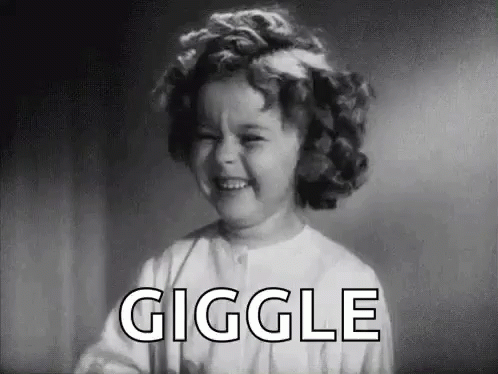 A Black And White Photo Of A Little Girl Laughing With The Word Giggle In The Background . GIF