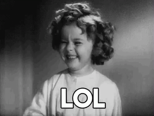 A Black And White Photo Of A Little Girl Laughing With The Word Lol . GIF