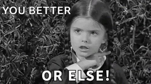 A Black And White Photo Of A Little Girl Pointing At The Camera And Saying `` You Better Or Else '' . GIF