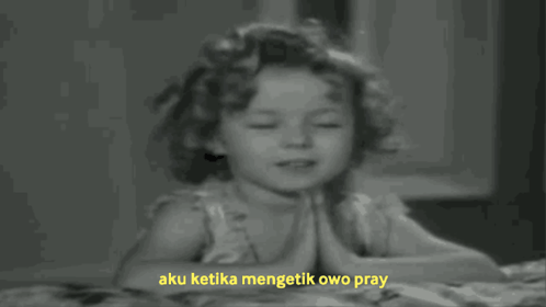 A Black And White Photo Of A Little Girl Praying With The Words Aku Ketika Mengetik Owo Pray Above Her GIF