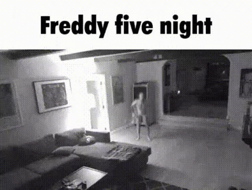 A Black And White Photo Of A Living Room With A Person Standing In It . GIF