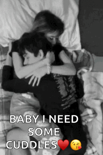 A Black And White Photo Of A Man And A Woman Hugging With The Caption Baby I Need Some Cuddles GIF