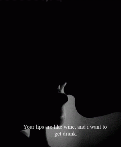 A Black And White Photo Of A Man And A Woman Kissing With The Caption Your Lips Are Like Wine And I Want To Get Drunk GIF
