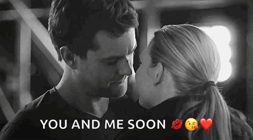 A Black And White Photo Of A Man And A Woman Kissing With The Words You And Me Soon Below Them GIF