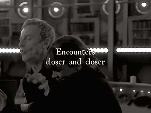 A Black And White Photo Of A Man And A Woman With The Words Encounters Closer And Closer GIF