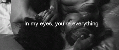A Black And White Photo Of A Man And A Woman With The Words In My Eyes You 'Re Everything GIF