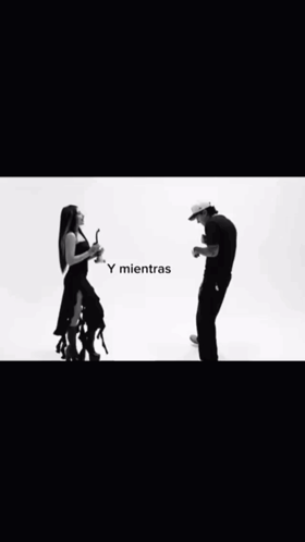 A Black And White Photo Of A Man And Woman GIF