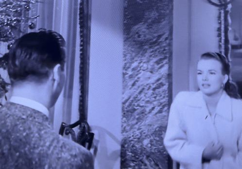 A Black And White Photo Of A Man And Woman GIF