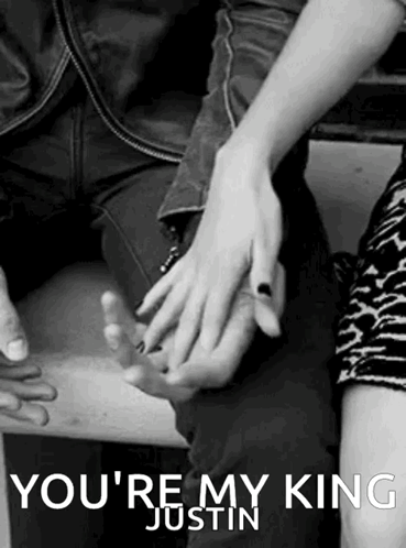 A Black And White Photo Of A Man And Woman Holding Hands With The Caption " You 'Re My King Justin " . GIF