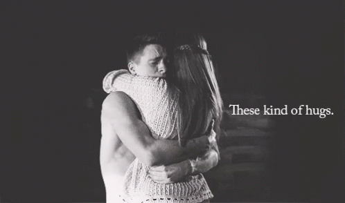 A Black And White Photo Of A Man And Woman Hugging With The Words These Kind Of Hugs Below Them GIF