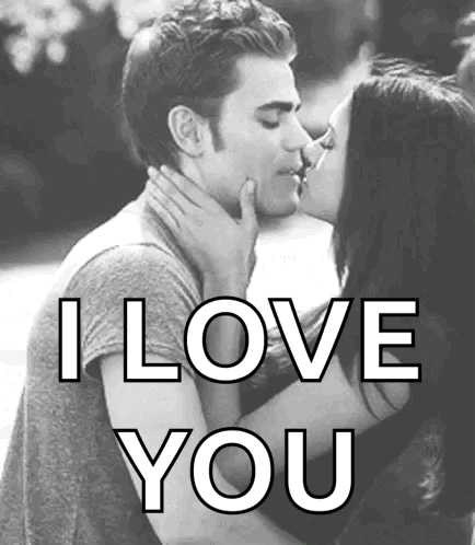 A Black And White Photo Of A Man And Woman Kissing With The Words `` I Love You '' Written Below Them . GIF