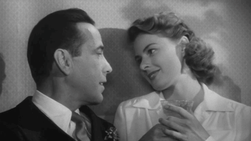 a black and white photo of a man and woman