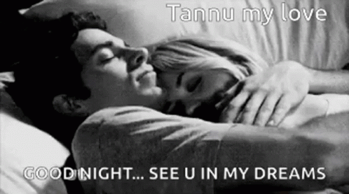 A Black And White Photo Of A Man And Woman Sleeping In Bed . GIF