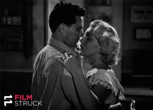 A Black And White Photo Of A Man And Woman With The Words Film Struck On The Bottom Right GIF