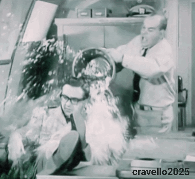 A Black And White Photo Of A Man Being Poured Into Another Man 'S Face And The Year 2025 GIF