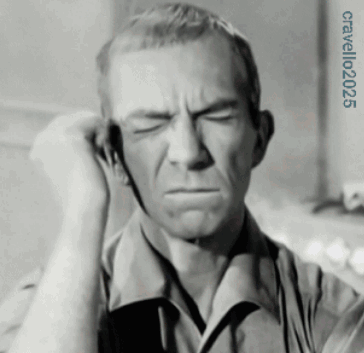 A Black And White Photo Of A Man Covering His Ear With His Hands And The Year 2025 On The Bottom GIF