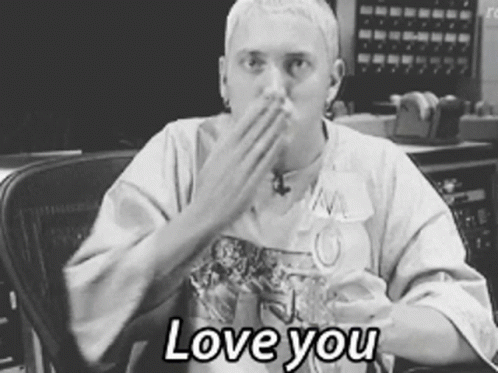 A Black And White Photo Of A Man Covering His Mouth With His Hand And The Words " Love You " Below Him GIF