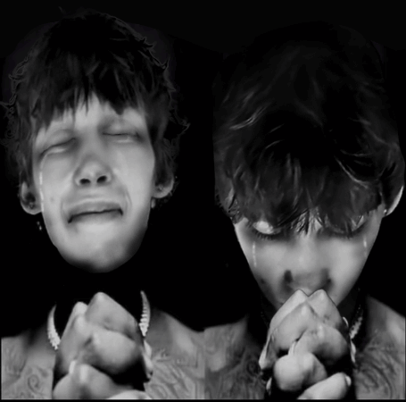 A Black And White Photo Of A Man Crying And Another Man Praying GIF