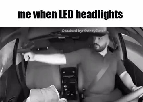 A Black And White Photo Of A Man Driving A Car With The Caption Me When Led Headlights GIF