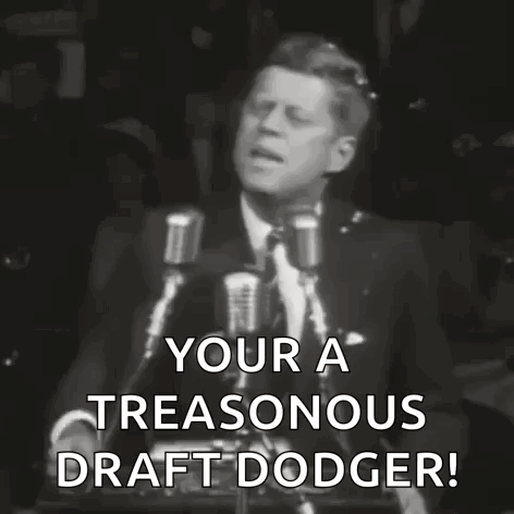 A Black And White Photo Of A Man Giving A Speech That Says Your A Treasonous Draft Dodger . GIF