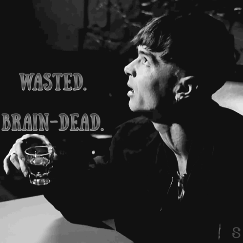 A Black And White Photo Of A Man Holding A Shot Glass And The Words Wasted Brain-Dead GIF
