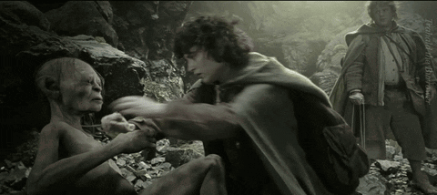 A Black And White Photo Of A Man Holding Another Man 'S Arm GIF