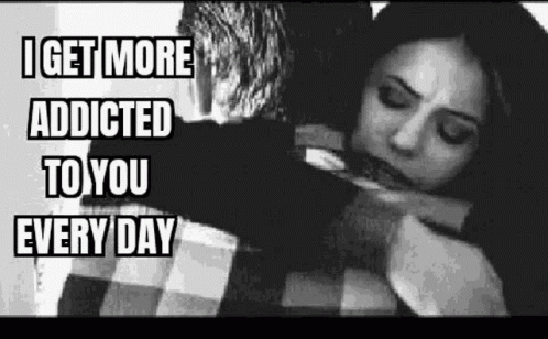 A Black And White Photo Of A Man Hugging A Woman . GIF