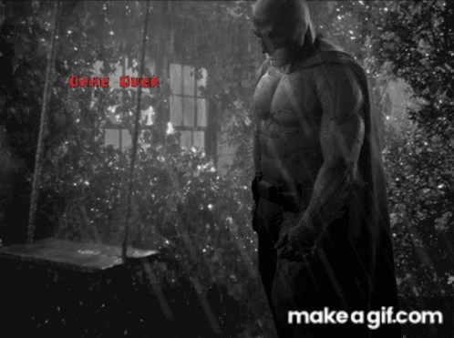 A Black And White Photo Of A Man In A Cape With The Words " Game Over " On The Bottom GIF