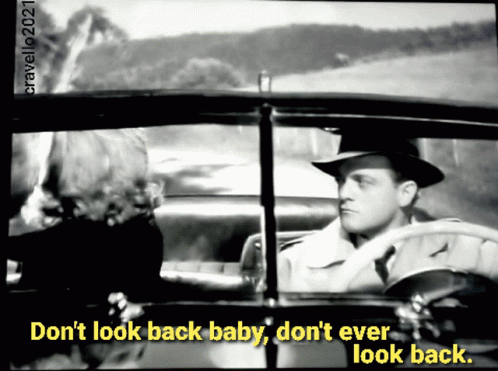 A Black And White Photo Of A Man In A Car With The Caption Do N't Look Back Baby Do N't Ever Look Back. GIF