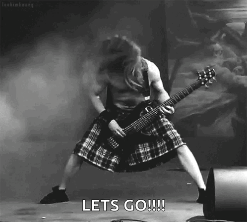 A Black And White Photo Of A Man In A Kilt Playing A Guitar With The Words Let 'S Go !!! Below Him GIF