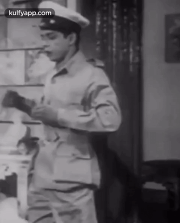 A Black And White Photo Of A Man In A Military Uniform With Kulfyapp.com At The Bottom GIF