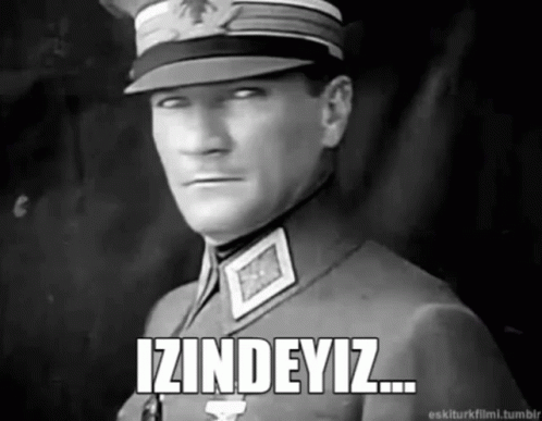 A Black And White Photo Of A Man In A Military Uniform With The Words Izindeyiz Written Below Him GIF