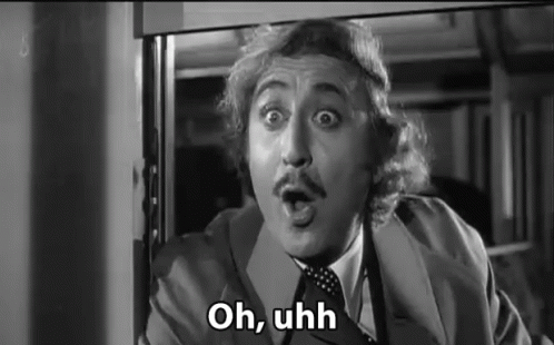 A Black And White Photo Of A Man In A Suit And Tie With His Mouth Open And The Words `` Oh , Uhh '' . GIF