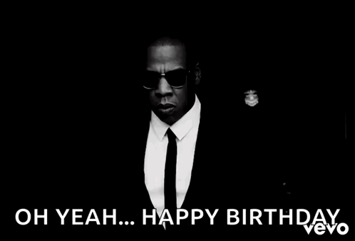 A Black And White Photo Of A Man In A Suit And Tie With The Caption " Oh Yeah ... Happy Birthday " GIF