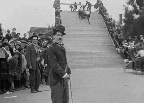 A Black And White Photo Of A Man In A Top Hat GIF