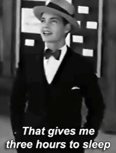 A Black And White Photo Of A Man In A Tuxedo And Hat That Says That Gives Me Three Hours To Sleep GIF