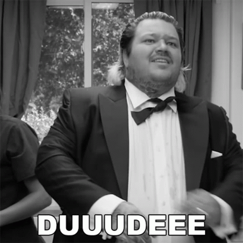 A Black And White Photo Of A Man In A Tuxedo With The Word Duuudee On The Bottom GIF