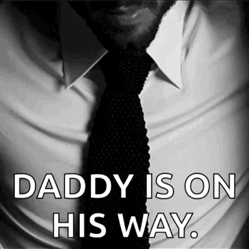 A Black And White Photo Of A Man In A White Shirt And Tie With The Words Daddy Is On His Way GIF
