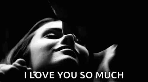 A Black And White Photo Of A Man Kissing A Woman 'S Forehead . GIF
