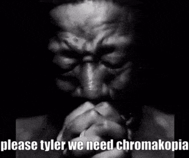 A Black And White Photo Of A Man Praying With His Hands Folded In Front Of His Face . GIF
