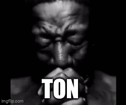 A Black And White Photo Of A Man Praying With The Word Ton Written In White Letters GIF