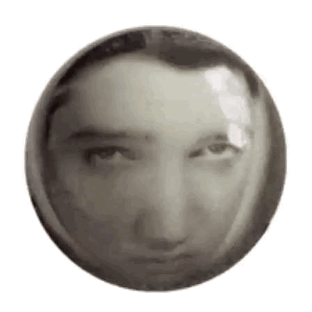 A Black And White Photo Of A Man 'S Face In A Circle . GIF