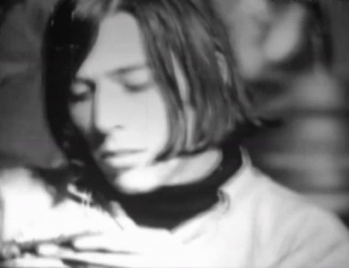 A Black And White Photo Of A Man 'S Face GIF