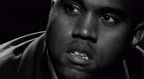A Black And White Photo Of A Man 'S Face With Tears Coming Down His Face . GIF