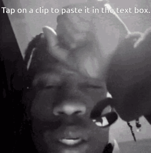 A Black And White Photo Of A Man 'S Face With The Caption Tap On A Clip To Paste It In The Text Box GIF